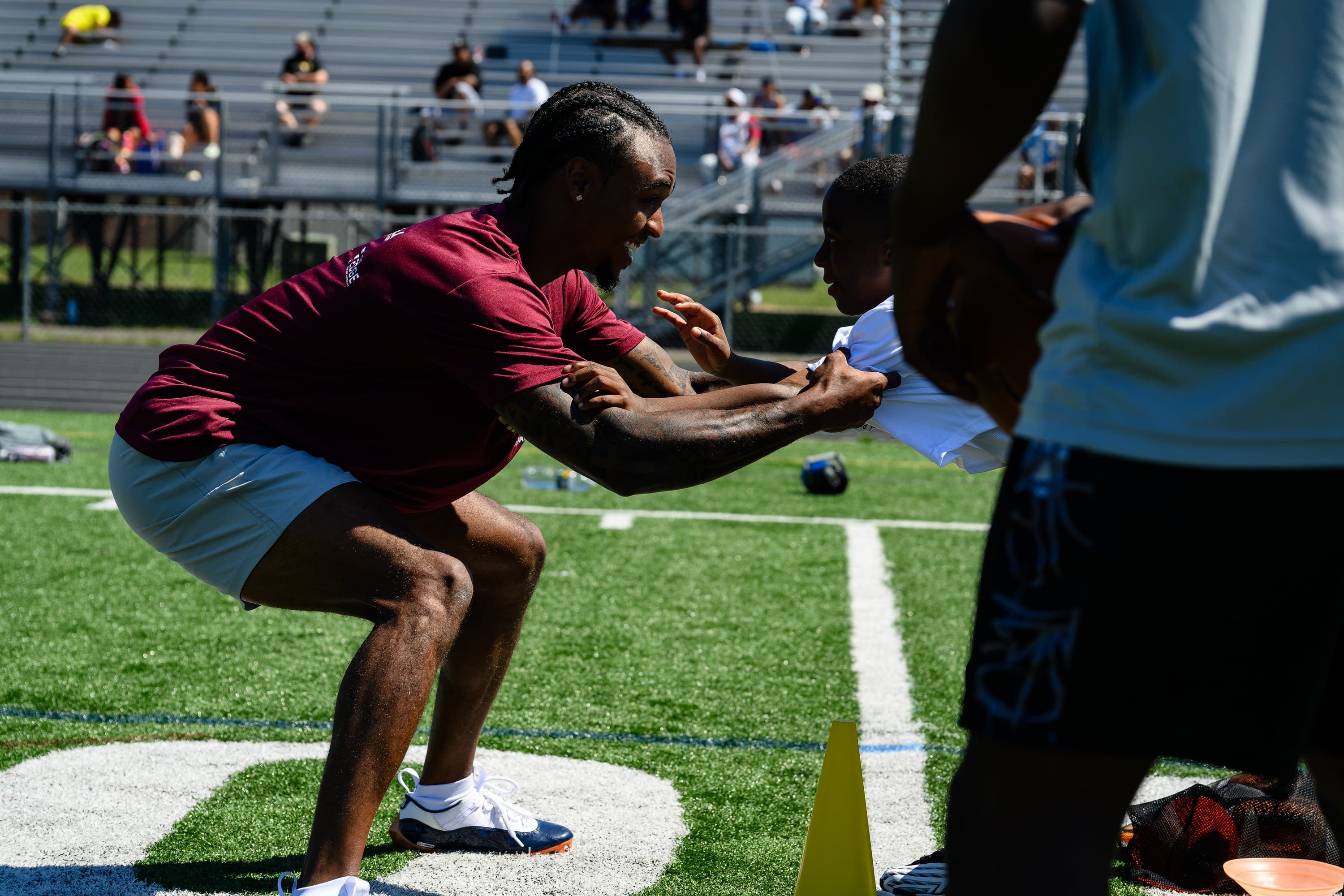Coach teaching football technique